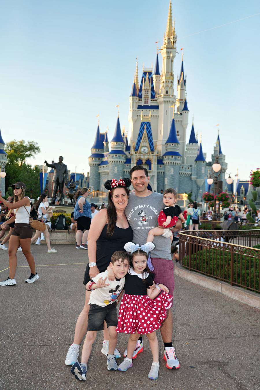A family in front of Cinderella Castle at Magic Kingdom